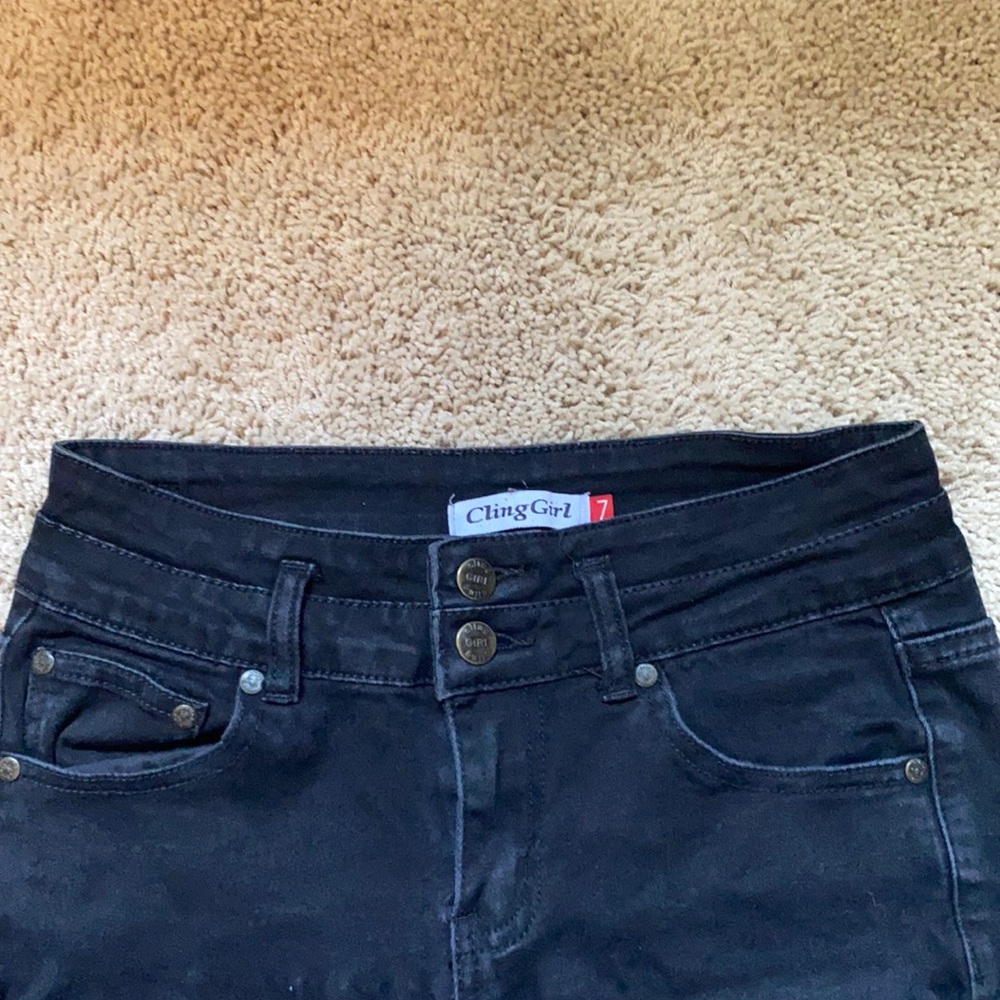 Cling Girl black torn jeans